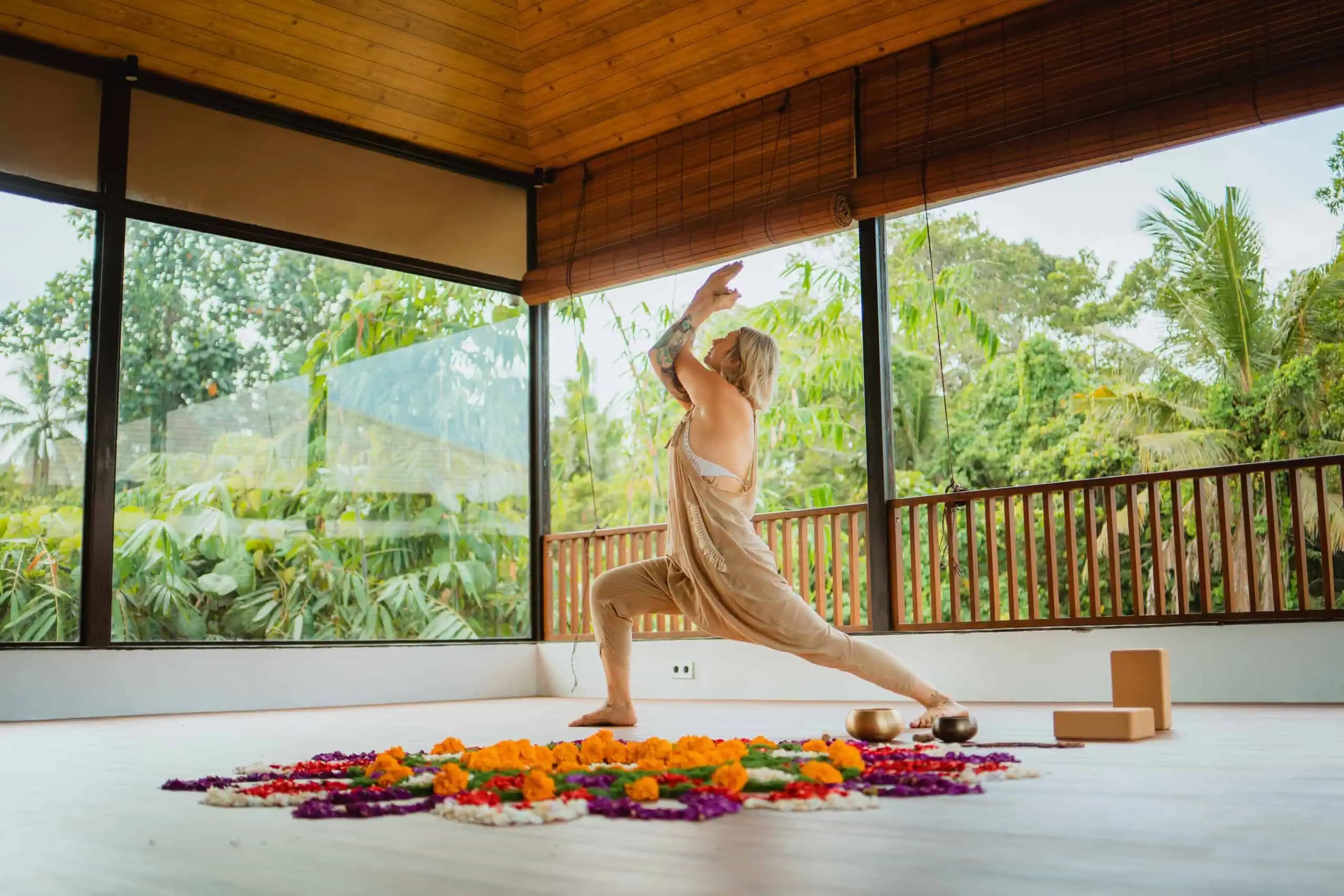 Ahamta Retreats open-air yoga shala in Ubud, Bali - A peaceful practice space surrounded by lush tropical vegetation where daily morning and evening yoga sessions take place